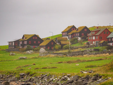 KirkjubÃ¸ur, Faroe Islands - October 2020: Typical wooden turf houses with red window on Streymoy Island., Denmark, Northern Europeのeditorial素材