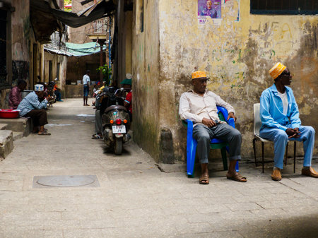Stone Town, Zanzibar, Tanzania - Jan 2021:, People on the narrow street of Stone Town. Africa.のeditorial素材