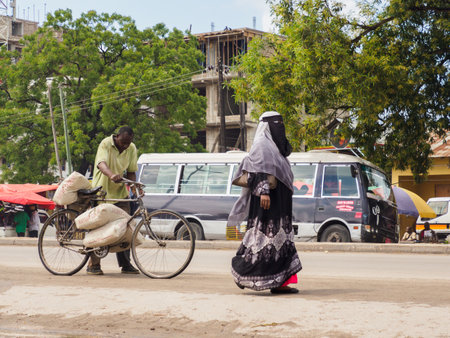 Zanzibar, Tanzania - Feb, 2021: The bicycle is a very popular means of transport in Africa, both for transporting people and various types of goods.. Covid time in Africa.のeditorial素材