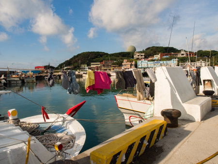 Fuji, Taiwan - October 2016: Hanging laundry that is life on fishing boats in Fuji Fishing Harbour. Fishing Port, Republic of China, Taiwan, Asiaのeditorial素材