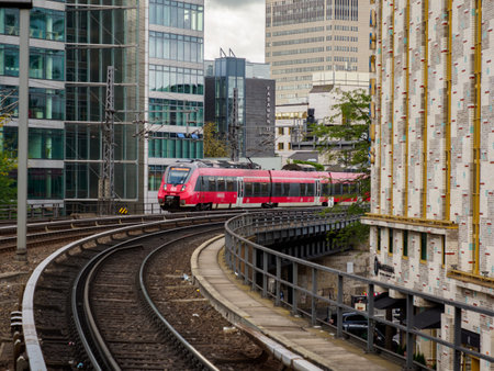 Berlin, Germany- Aug 2020: Traditional yellow red S-Bahn city trains in Berlin arriving Berlin Zoo (Zoologische Garten) Station. Europeのeditorial素材