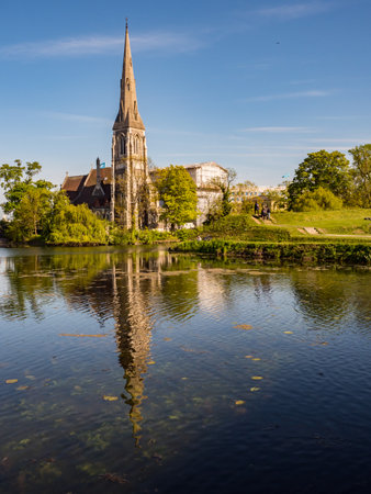 Copenhagen, Denmark - May 2019: St Alban's Church seen from Kastellet Bridge above the moat near the Kastellet fortress. It is an Anglican church in Copenhagen. Europeのeditorial素材