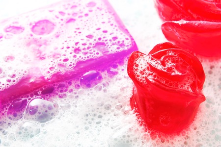 macro of glycerine soap with foam of pink and violetの写真素材