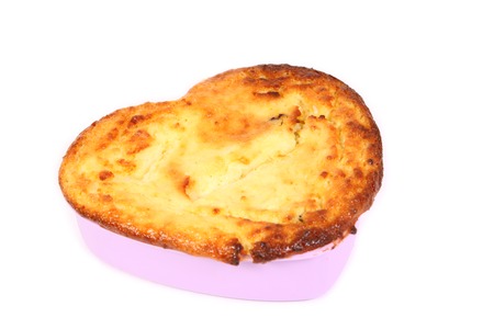 casserole in the  form of heart on whiteの写真素材