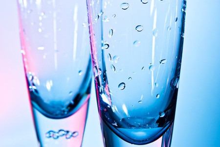 glass for champagne  on blue and red backgroundの写真素材