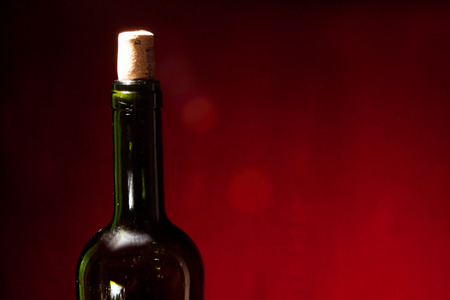 wine bottle, glass on red. steel lifeの写真素材