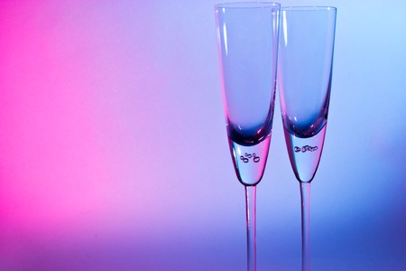 glass for champagne  on blue and red backgroundの写真素材