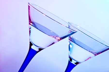glass for martini  on blue and red backgroundの写真素材