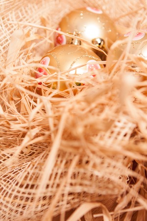 new year background with toy and strow in gold colourの写真素材