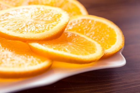 orange and kiwi on plate. be diferent. 