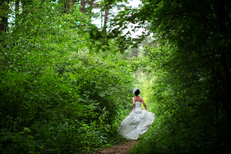runaway bride in the forestの写真素材