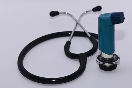 Stethoscope with a salbutamol inhaler- diagnosis and treatment in one picture.の写真素材