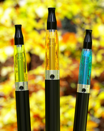 Electronic cigarettes with an autumn backgroundの写真素材