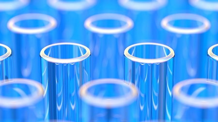 Close up on rows of glass test tubes, with blue reflectionsの写真素材