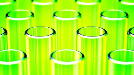 Close up on rows of glass test tubes, with green reflectionsの写真素材