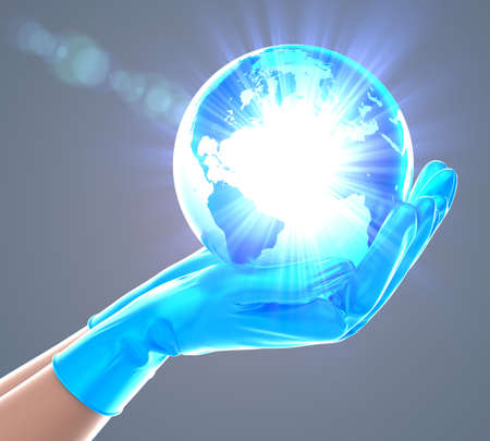 Close-up on delicate doctor's hands holding a shiny glass earthの写真素材