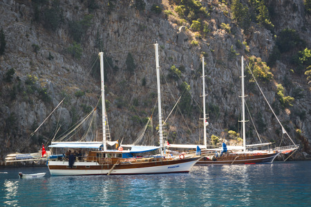 MuÄla, Turkey - September 9, 2013: Sailboats moored at Aegean Sea. Beach of Fethiye at Mugla-Turkey.のeditorial素材