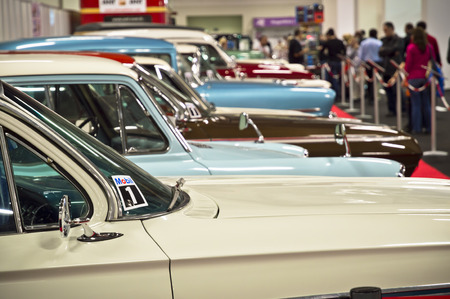 Beylikduzu, Istanbul , Turkey - November 05 , 2012: Old Fashioned Car on display during the Istanbul Autoshow 2012. People in the background are looking at the cars.のeditorial素材