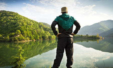 Man Looking to Lake