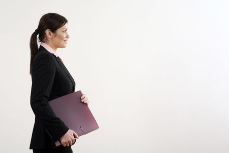 Businesswoman smiling while holding file