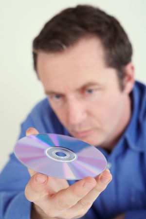 Man holding a compact discの写真素材