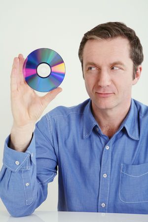 Man holding a compact discの写真素材