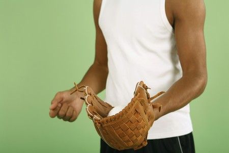Man with baseball glove and ballの写真素材