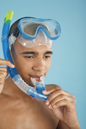 Man testing the snorkel he is wearingの写真素材