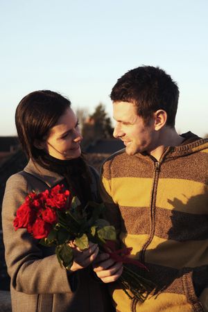 Woman receiving flowers from manの写真素材