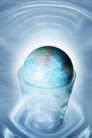 Globe in dustbinの写真素材