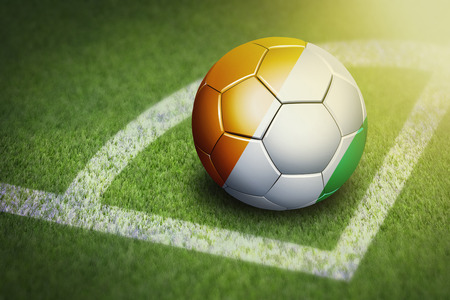 Taking a corner with Ivory Coast flag soccer ballの写真素材