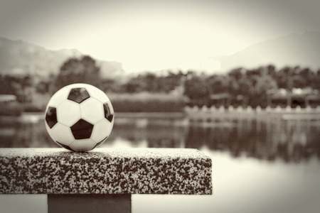 Soccer ball by the lakeの写真素材