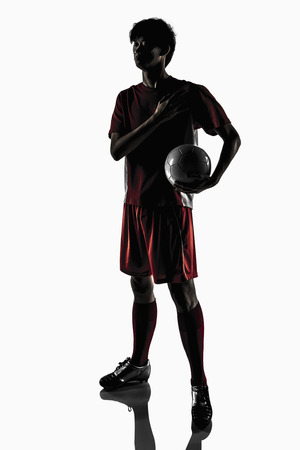 A soccer player listening to team anthemの写真素材
