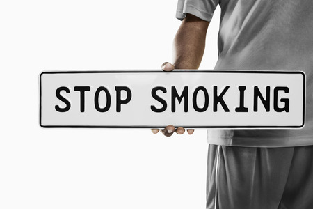 A soccer player holding ""stop smoking"" sign""の写真素材