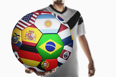 A soccer player holding world soccer ballの写真素材