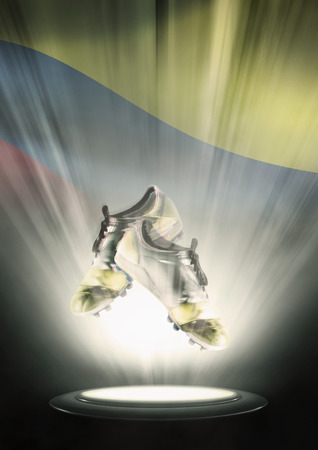 Football cleats with Colombia flag backdropの写真素材