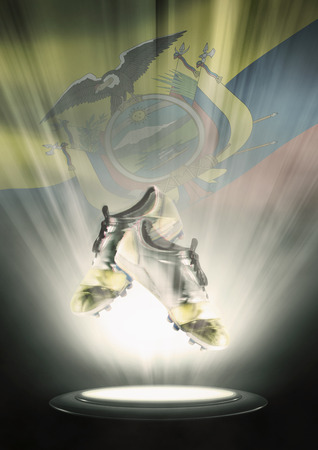 Football cleats with Ecuador flag backdropの写真素材