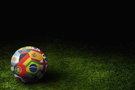World flags soccer ball on a playing fieldの写真素材