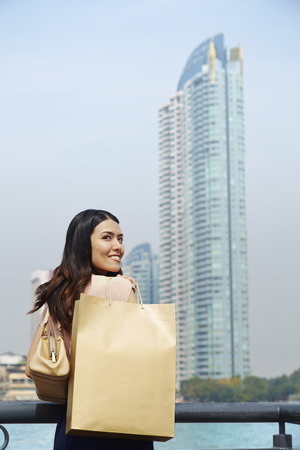 Young woman looking over her shoulderの写真素材