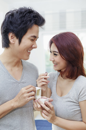 Boyfriend give his girlfriend a presentの写真素材