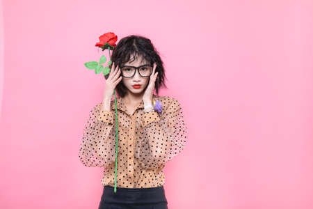 Young and beautiful women taking pictures in color studio