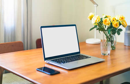 Laptop placed on a wooden table