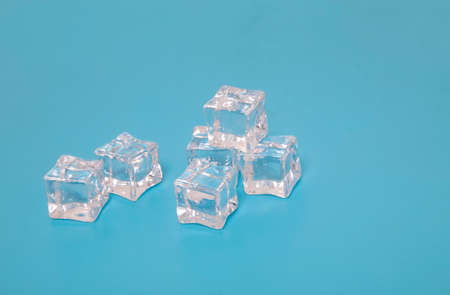 Ice cubes on blue background