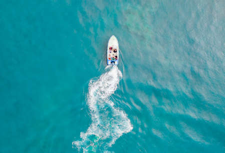 Vessels and speedboats moored on the seaの写真素材