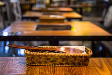Tableware on wooden table in restaurantの写真素材