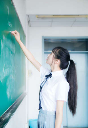 Portrait of a girl in a JK uniform in the classroomの写真素材