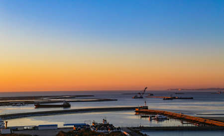 Sunrise at the Great Sea Wharf Construction Site in Beidaihe, Hebei, Chinaの写真素材