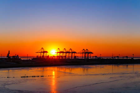 Sunrise at the Great Sea Wharf Construction Site in Beidaihe, Hebei, Chinaの写真素材
