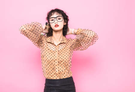 Young and beautiful female color studio photoの写真素材