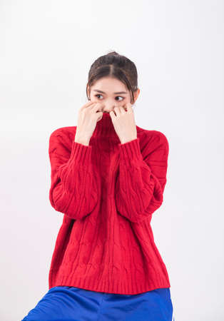 young woman in red sweaterの写真素材